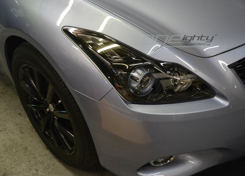 silver car headlight close-up