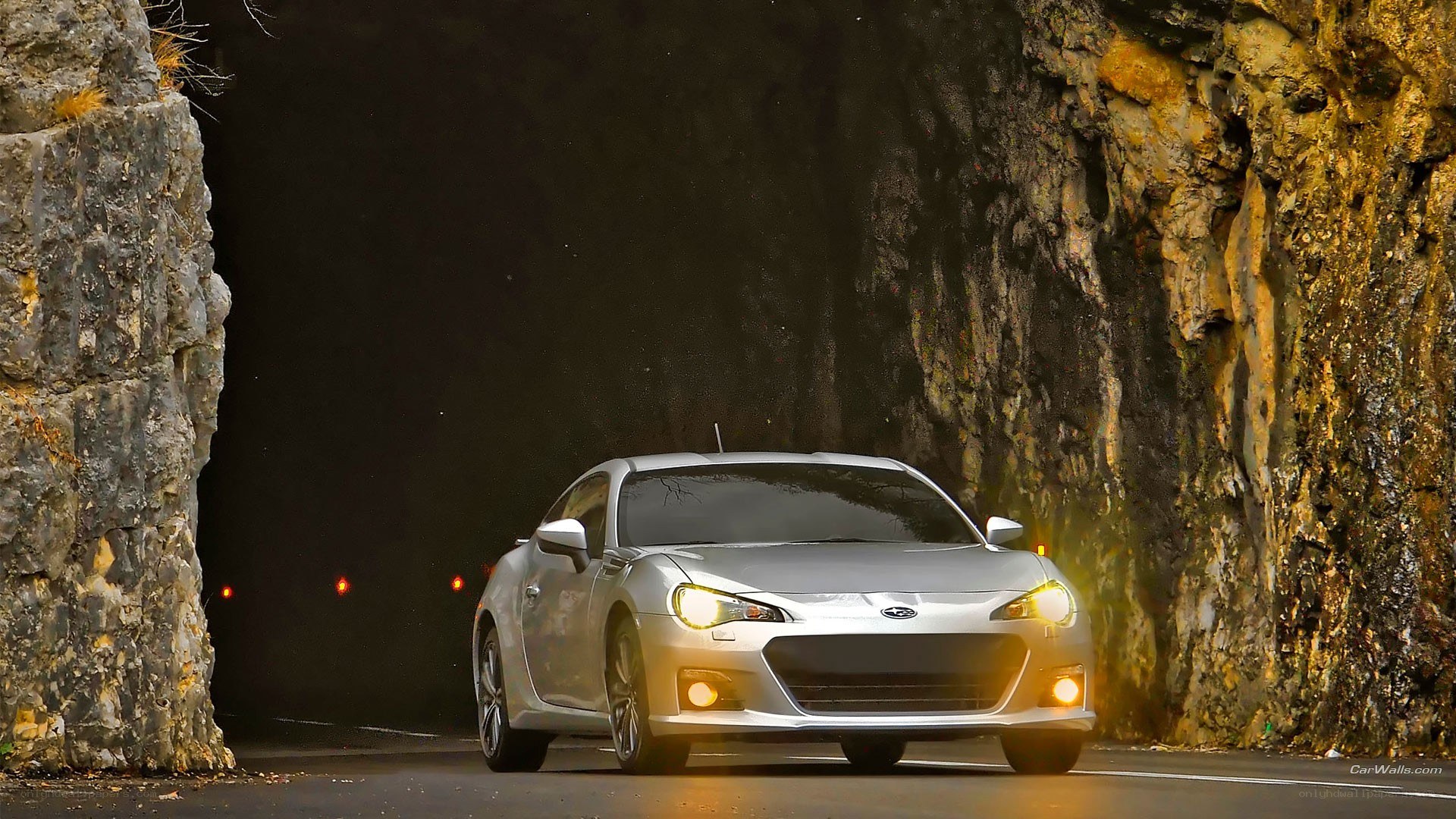 Silver car in a tunnel