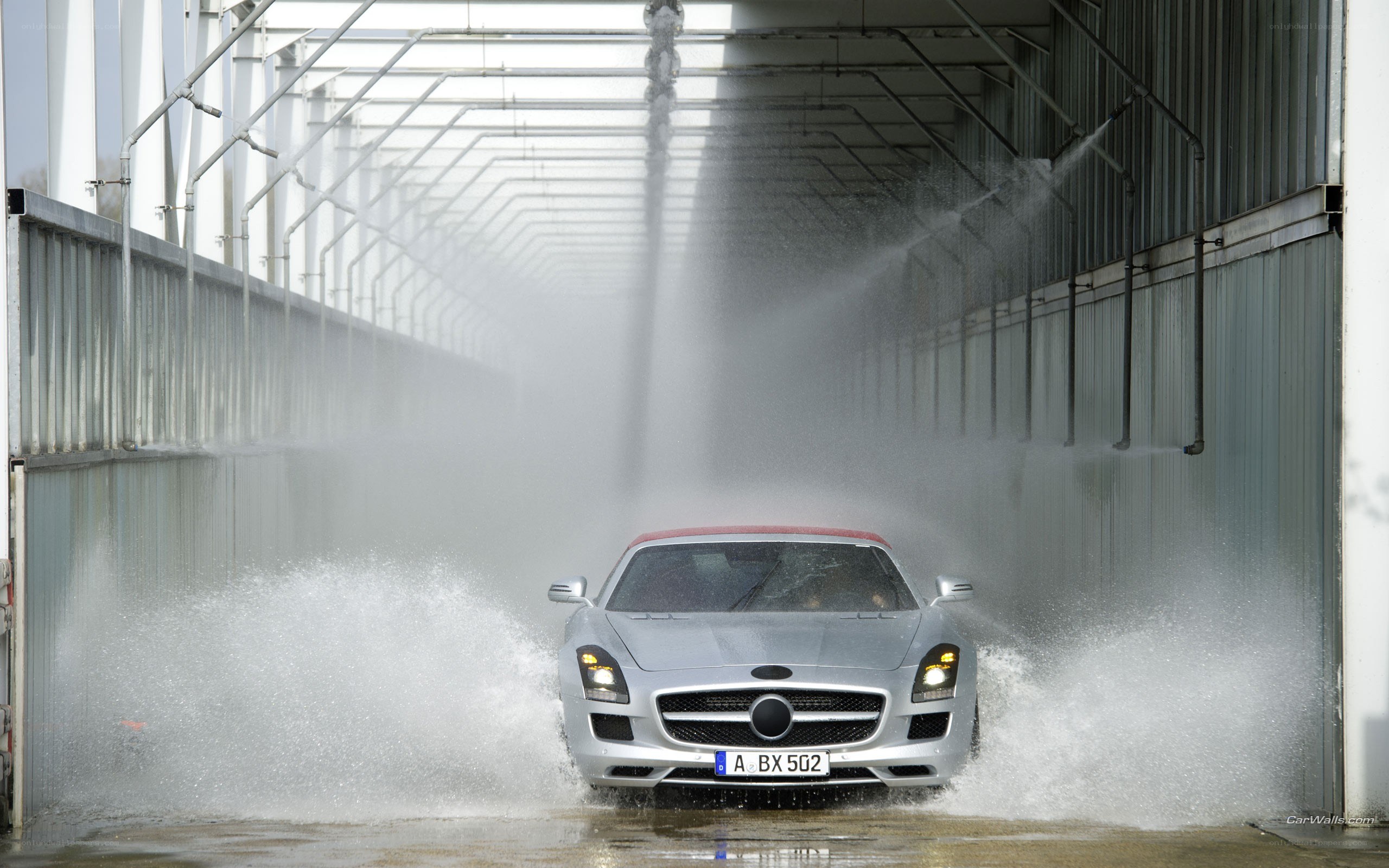 Silver car in car wash