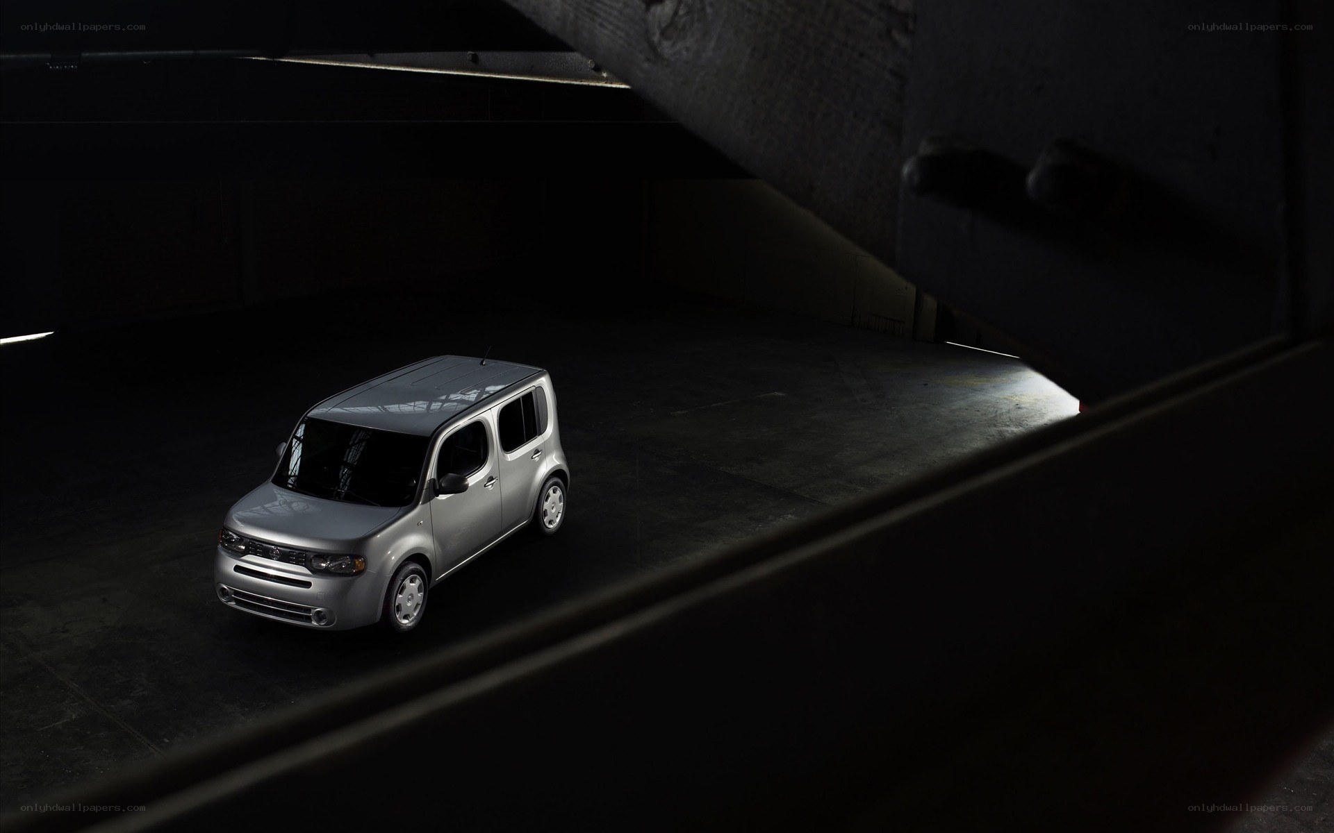 Silver car in dark garage