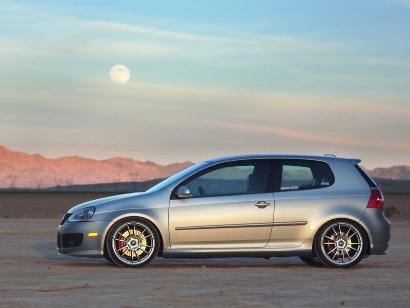silver car in desert at dusk