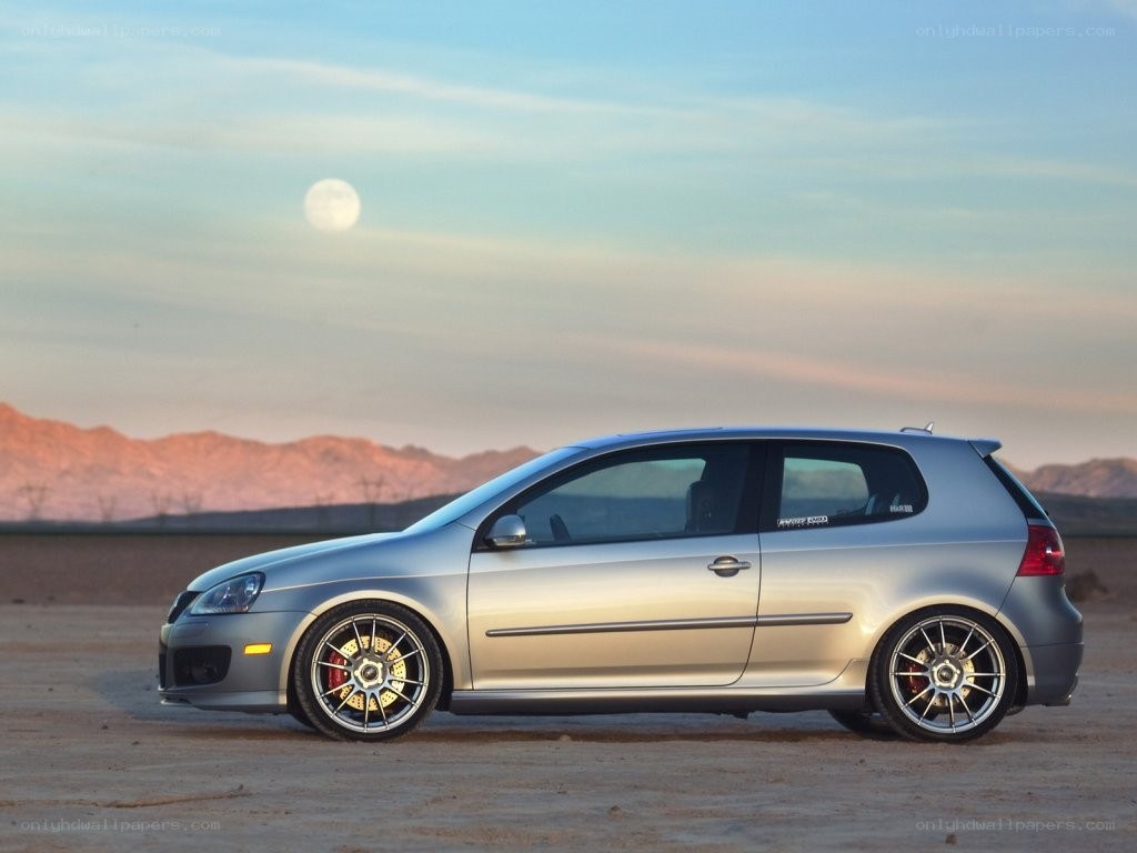 silver car in desert at dusk