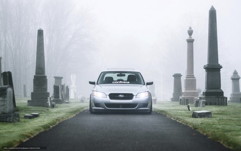 silver car in foggy cemetery