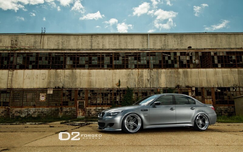 silver car in front of old building