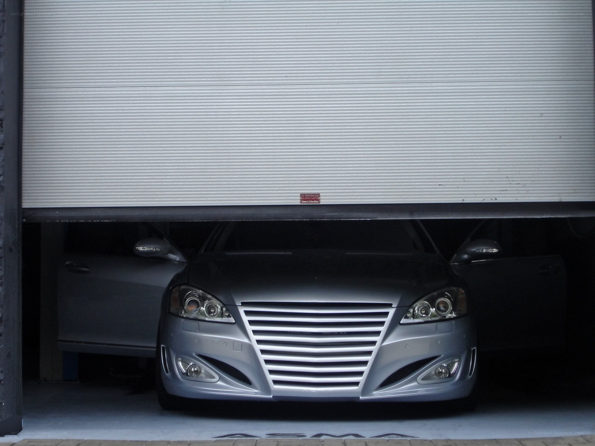 silver car in garage