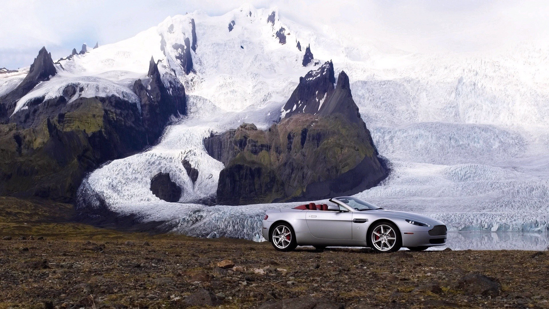 Silver car in glacier landscape