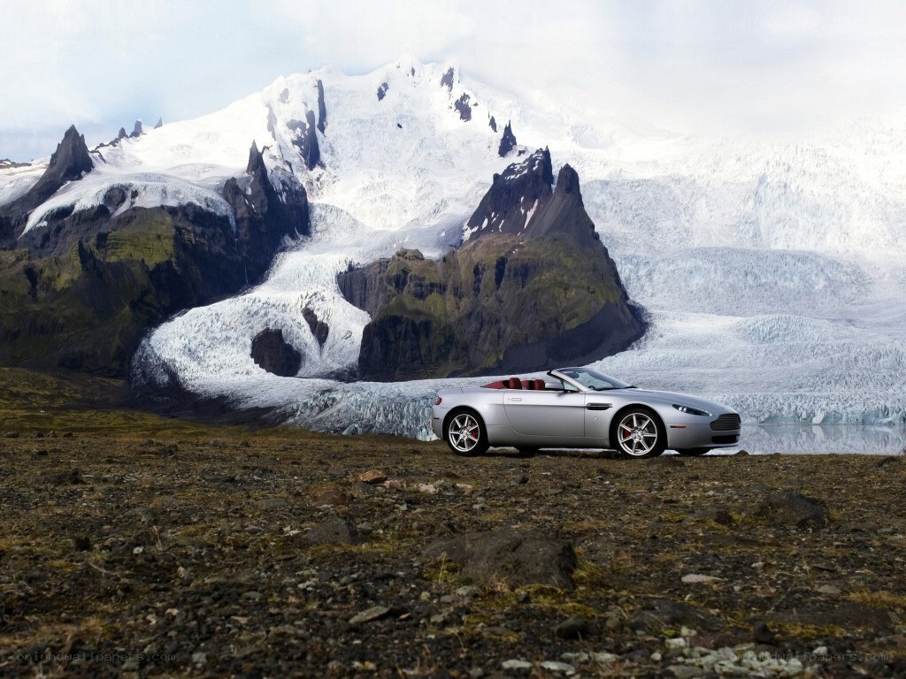 Silver car in glacier landscape