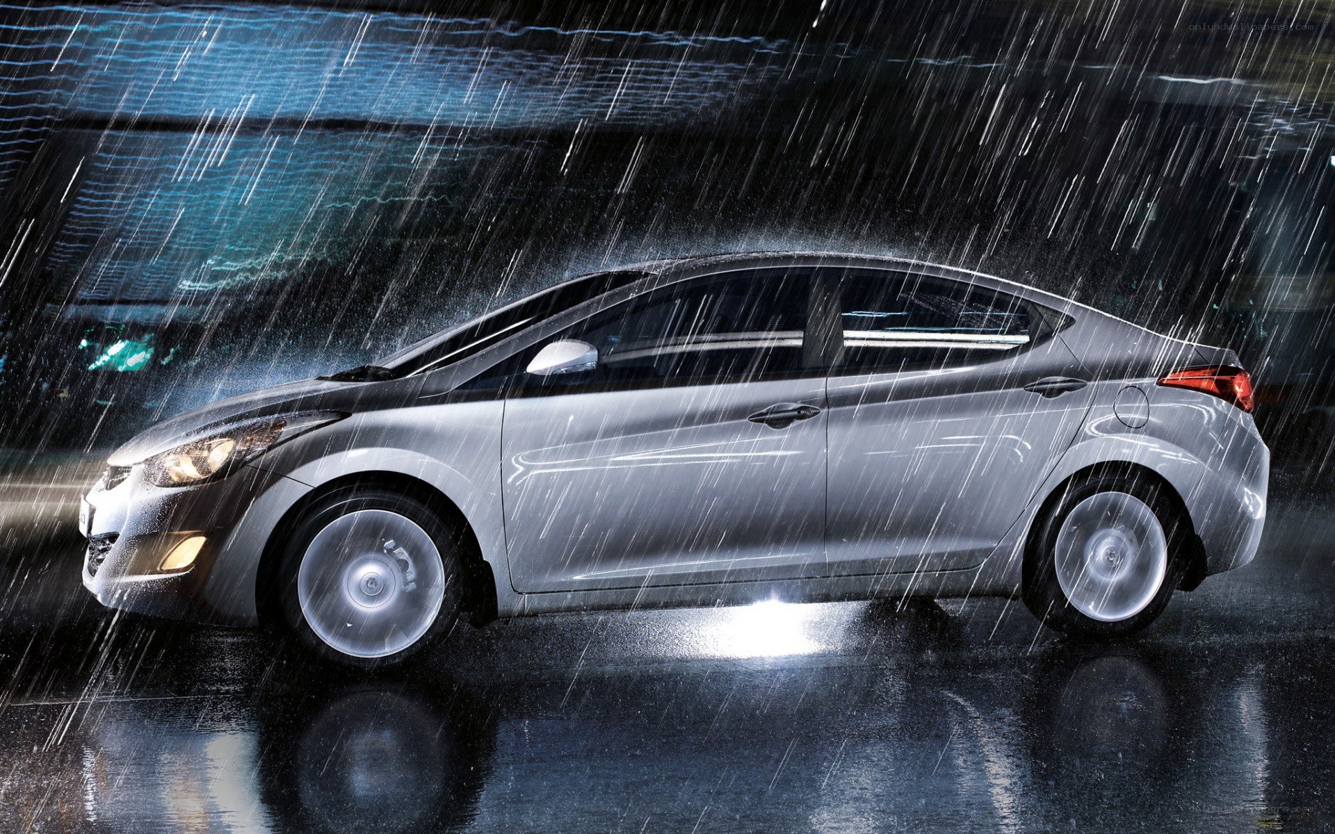 Silver car in heavy rain