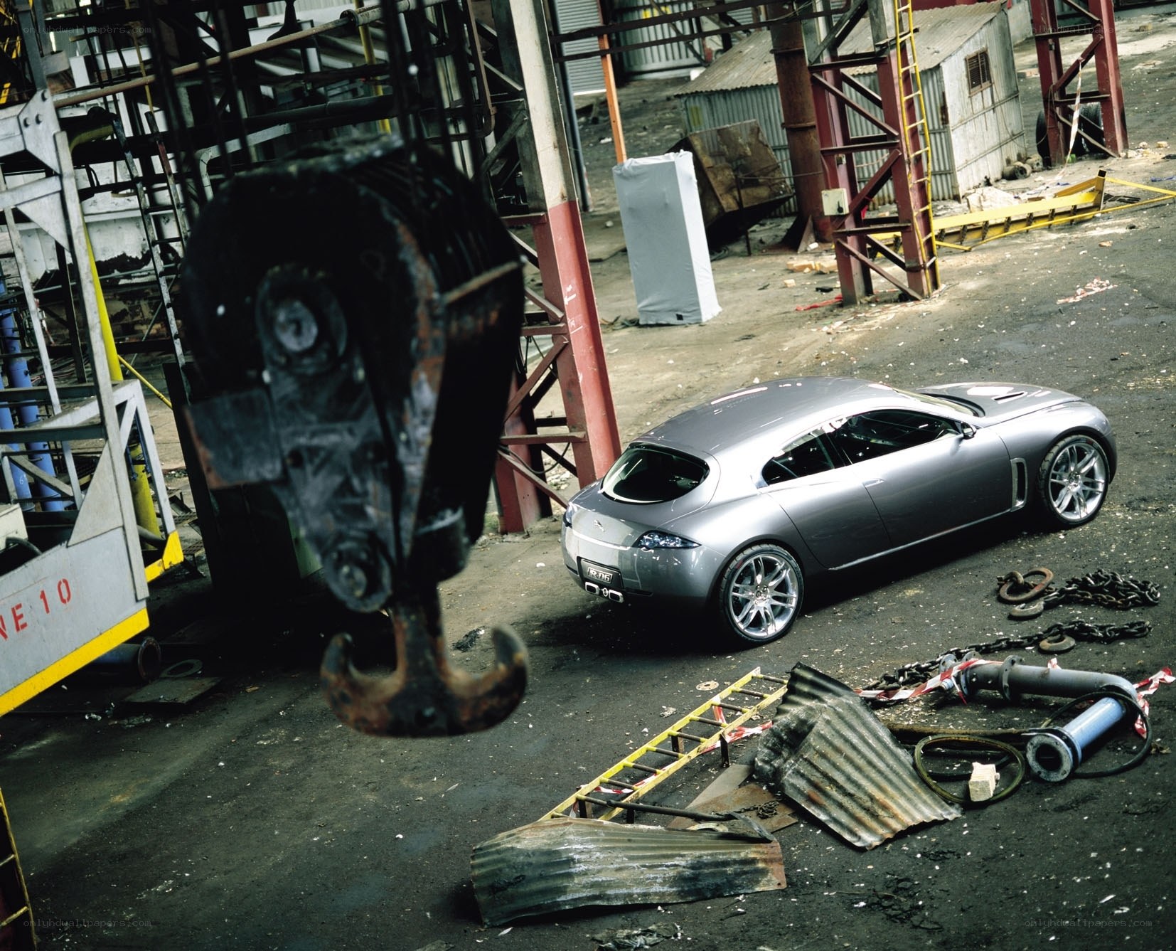 Silver car in industrial setting