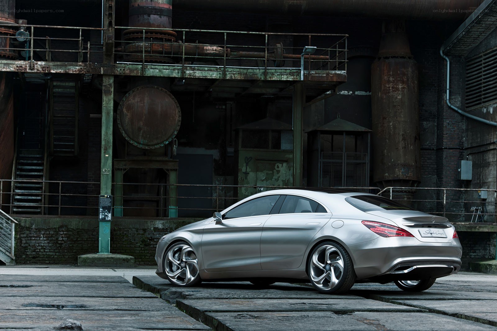 Silver car in industrial setting