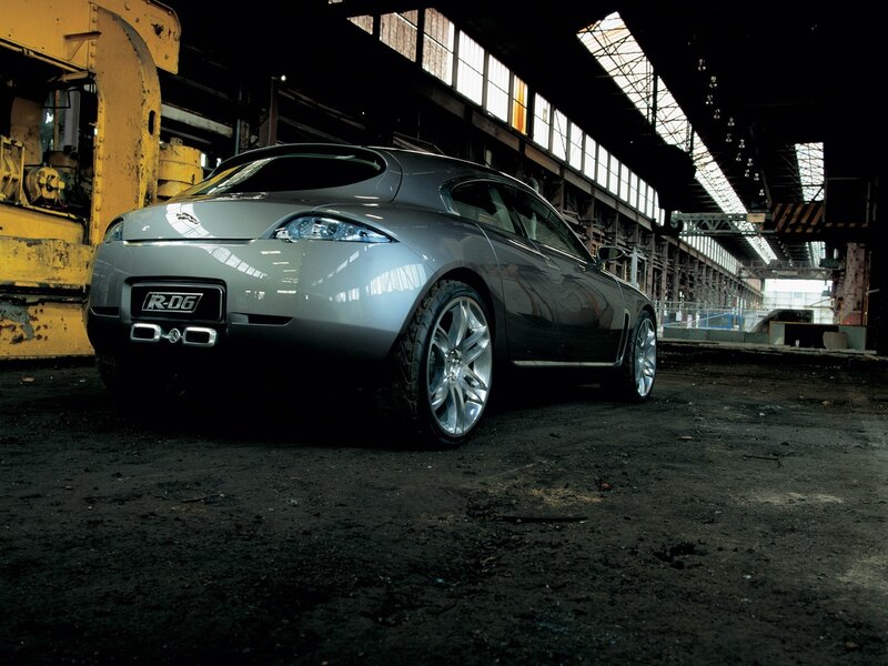 Silver car in industrial setting