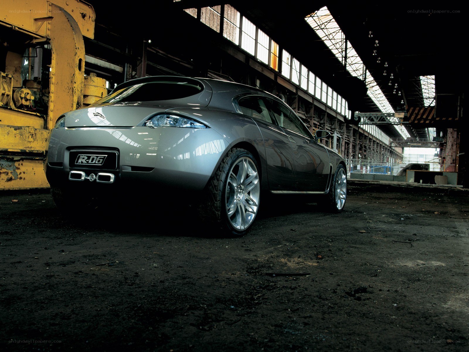 Silver car in industrial setting