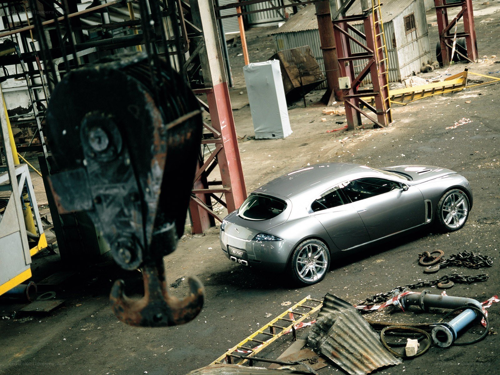 Silver car in industrial yard