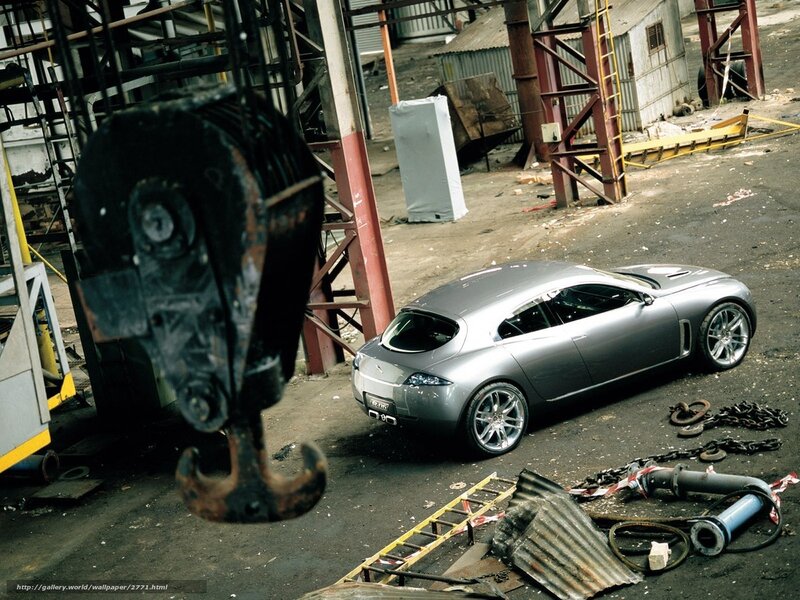 Silver car in industrial yard
