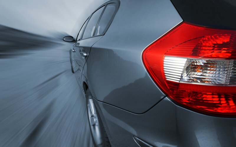 silver car in motion