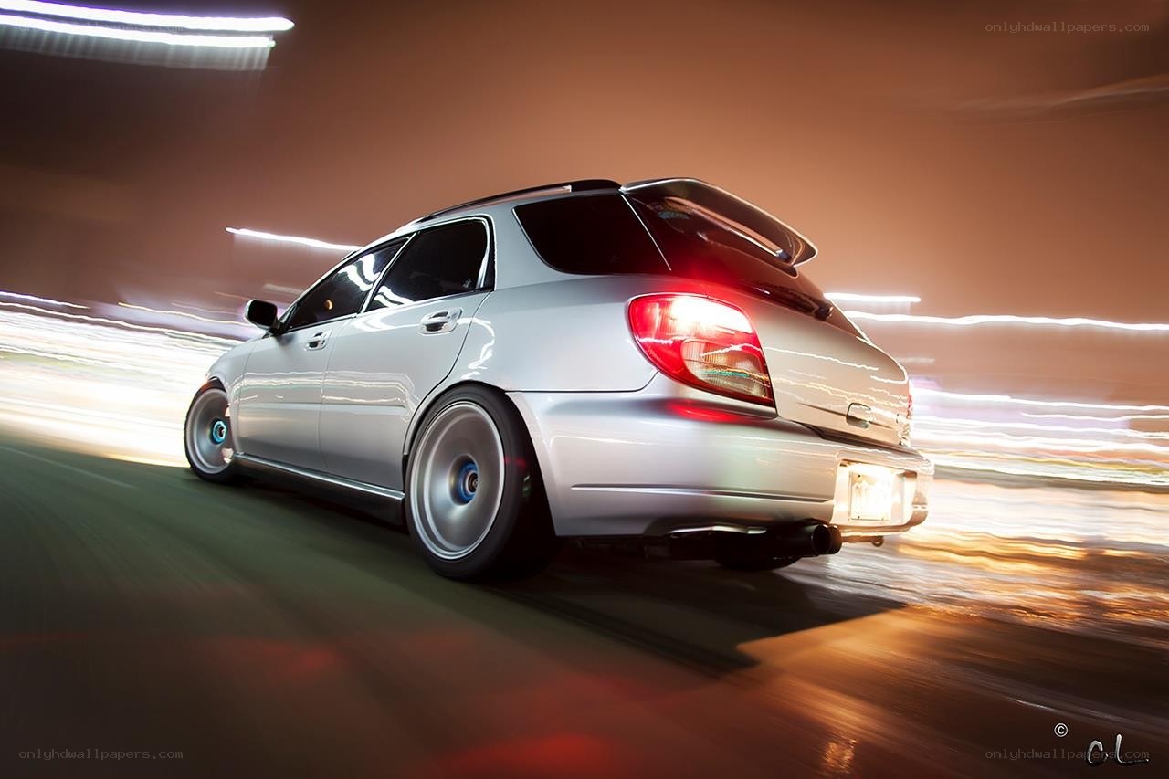 silver car in motion at night