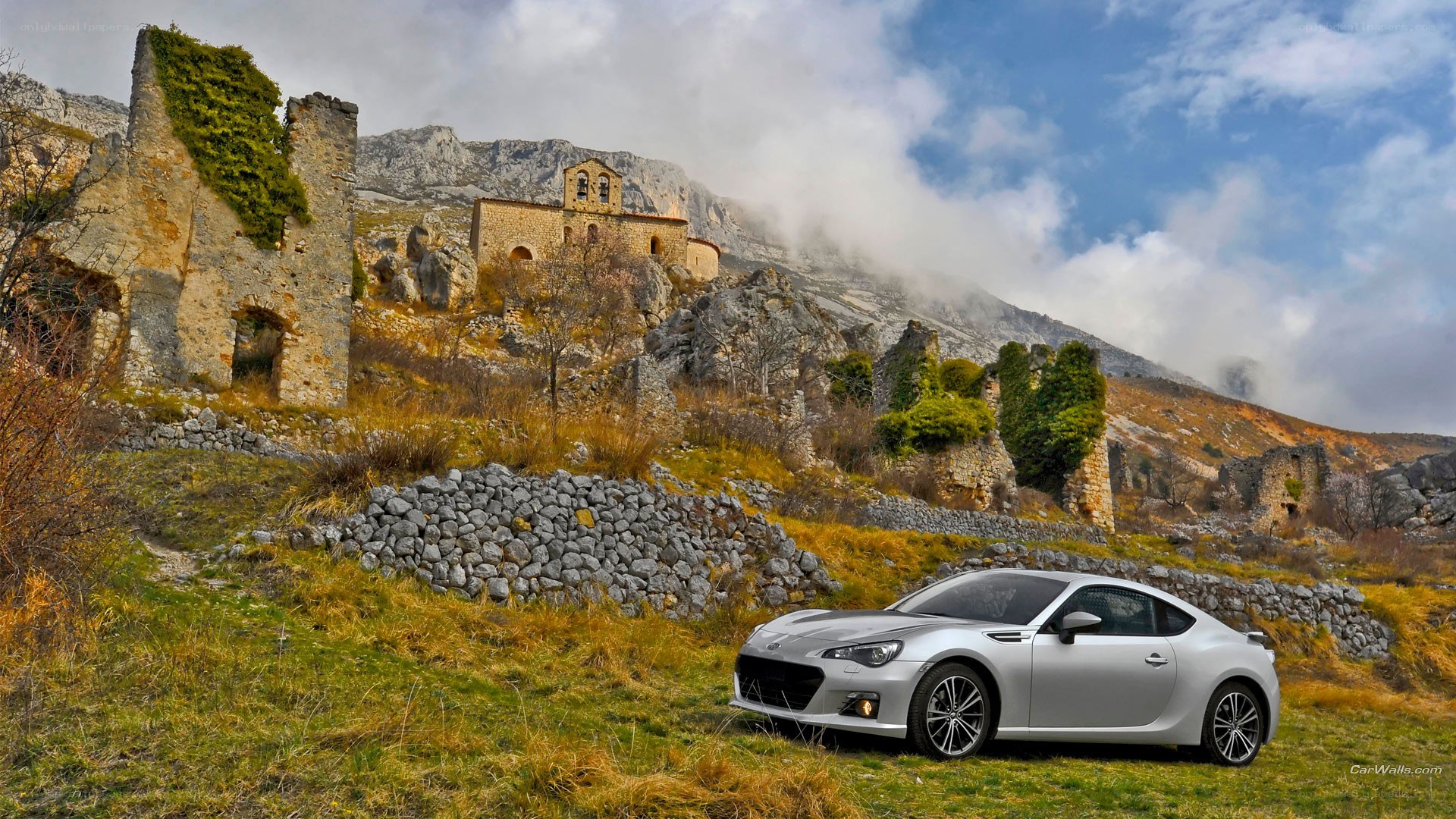 Silver car in mountain ruins
