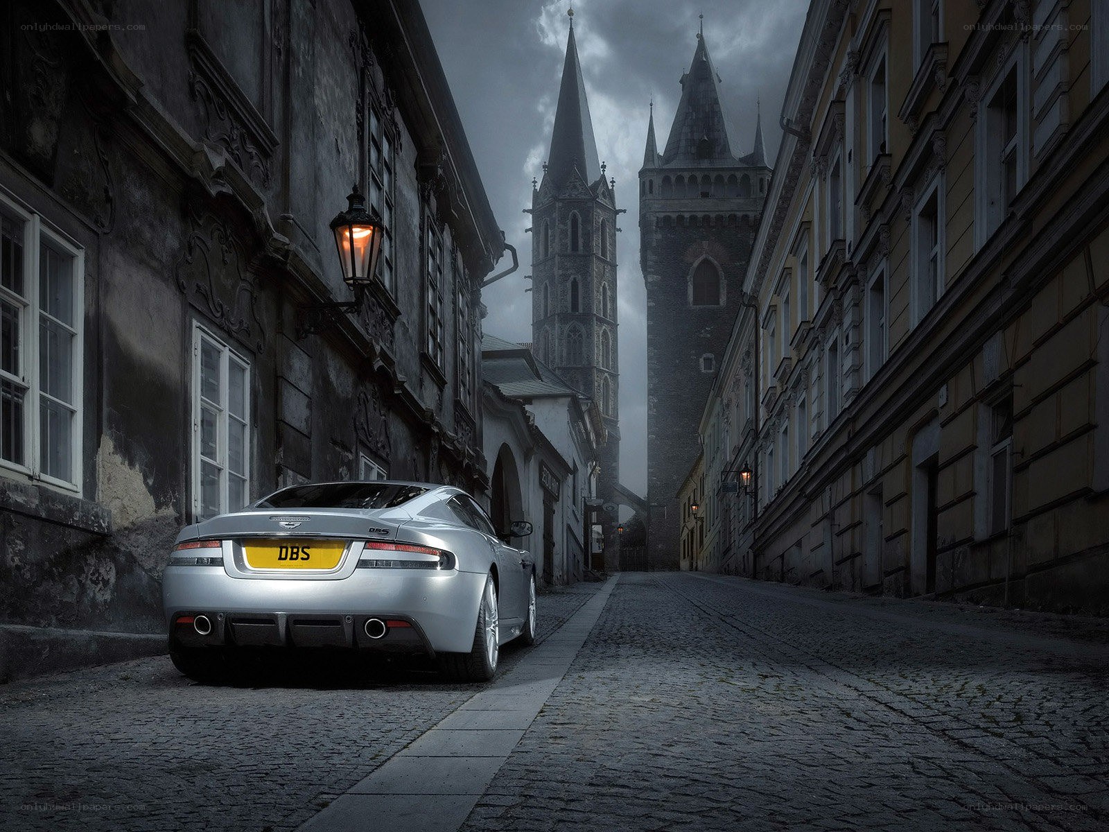 Silver car in old city street
