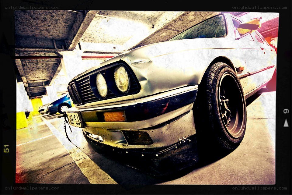 silver car in parking garage