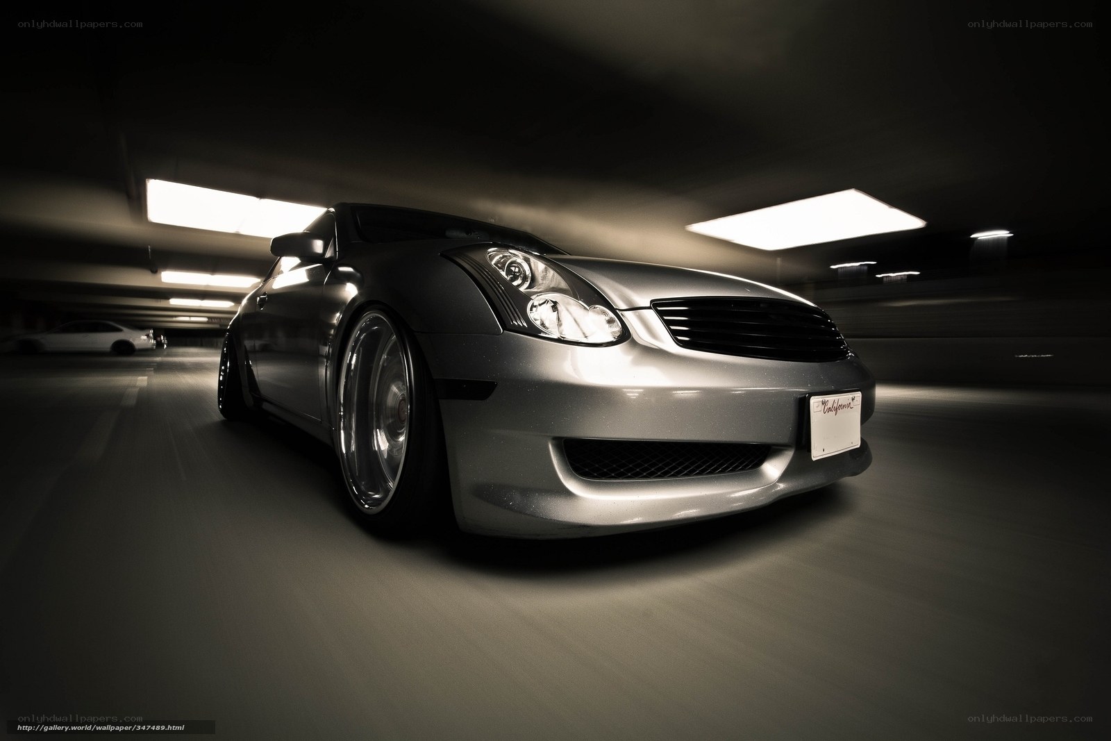 silver car in parking garage