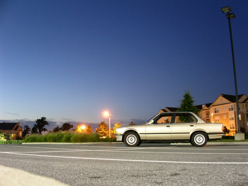 silver car in parking lot at dusk