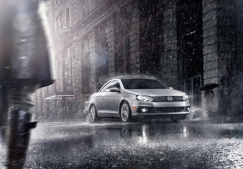 Silver car in rainy city