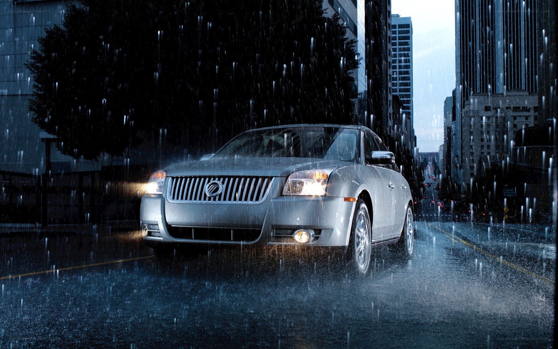 Silver car in rainy city