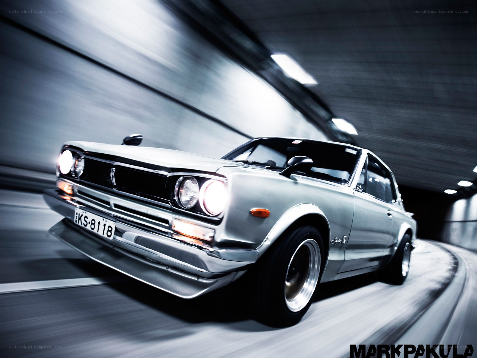 Silver car in tunnel