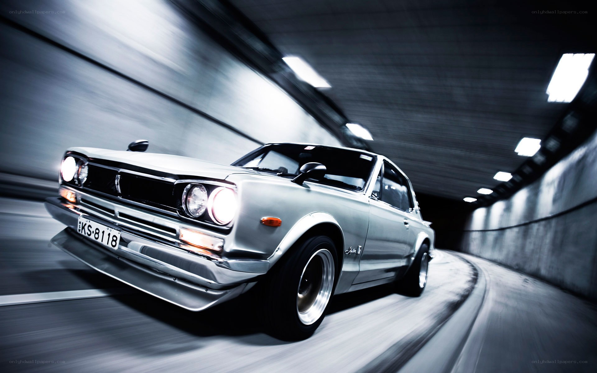 Silver car in tunnel