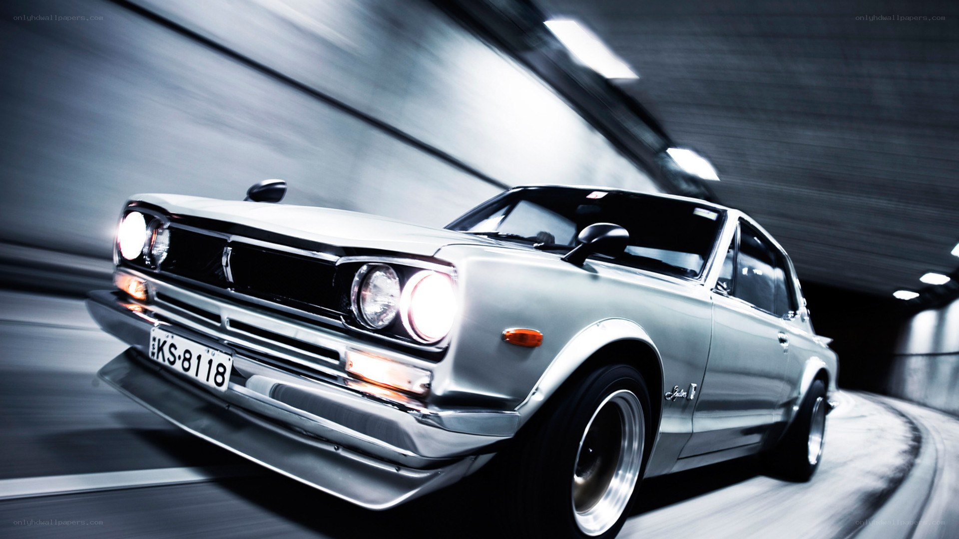 Silver car in tunnel