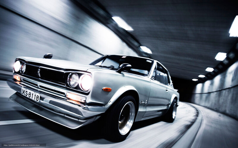 Silver car in tunnel