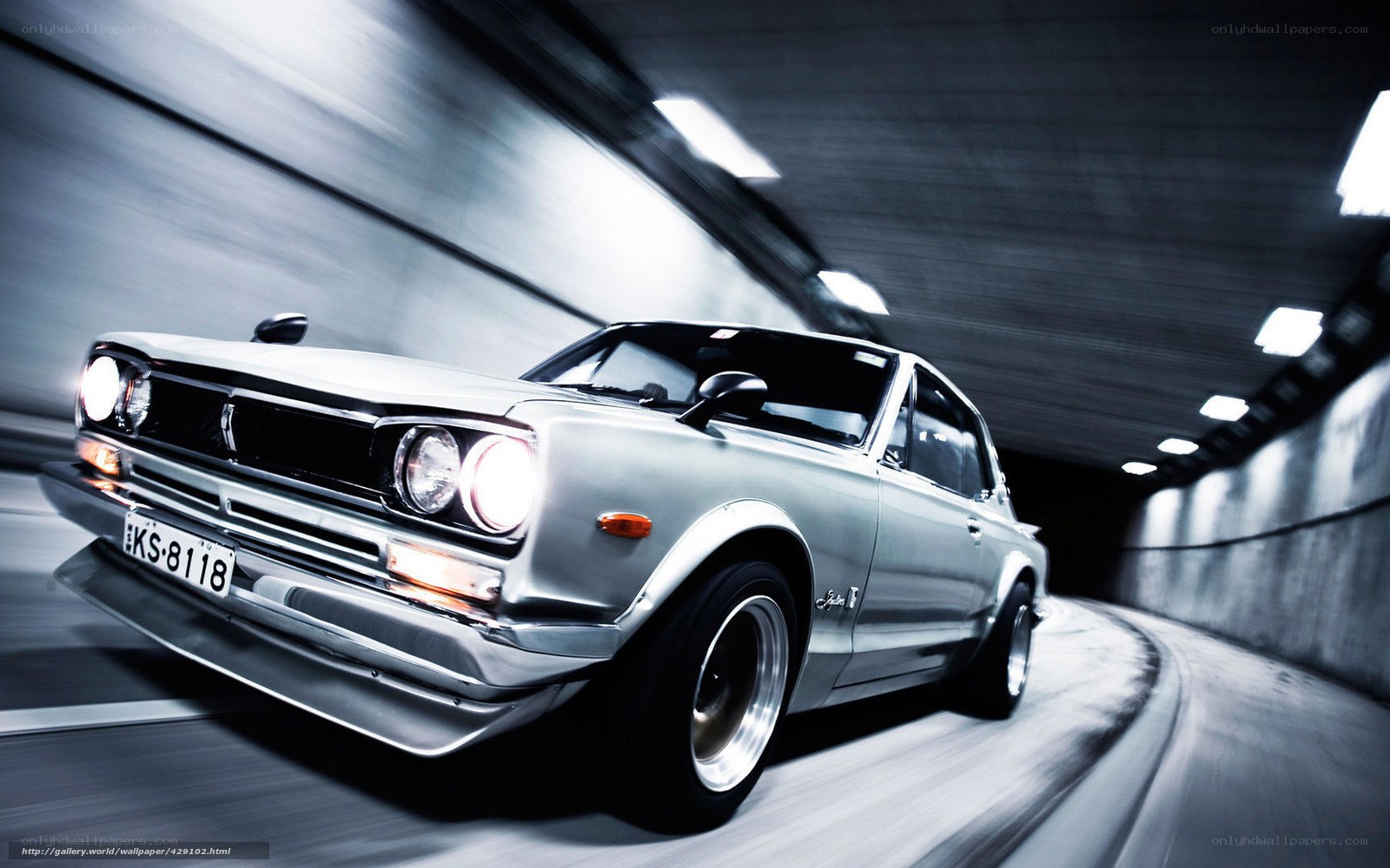 Silver car in tunnel