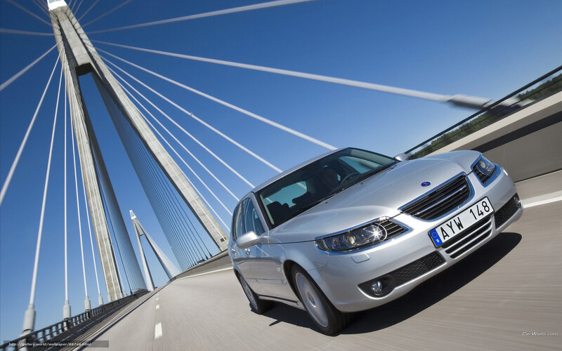 Silver car on a cable-stayed bridge