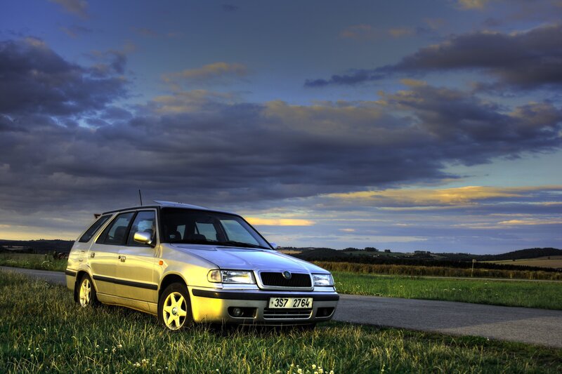 Silver car on a country road
