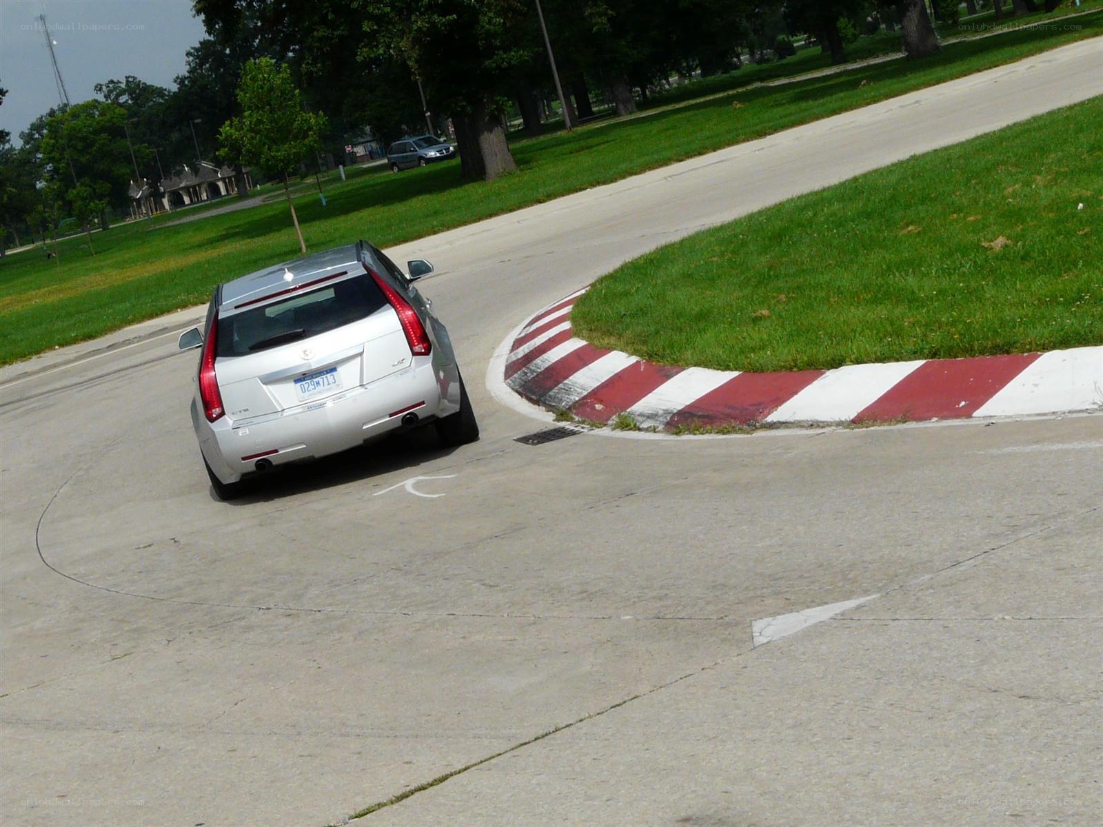 silver car on a curved road