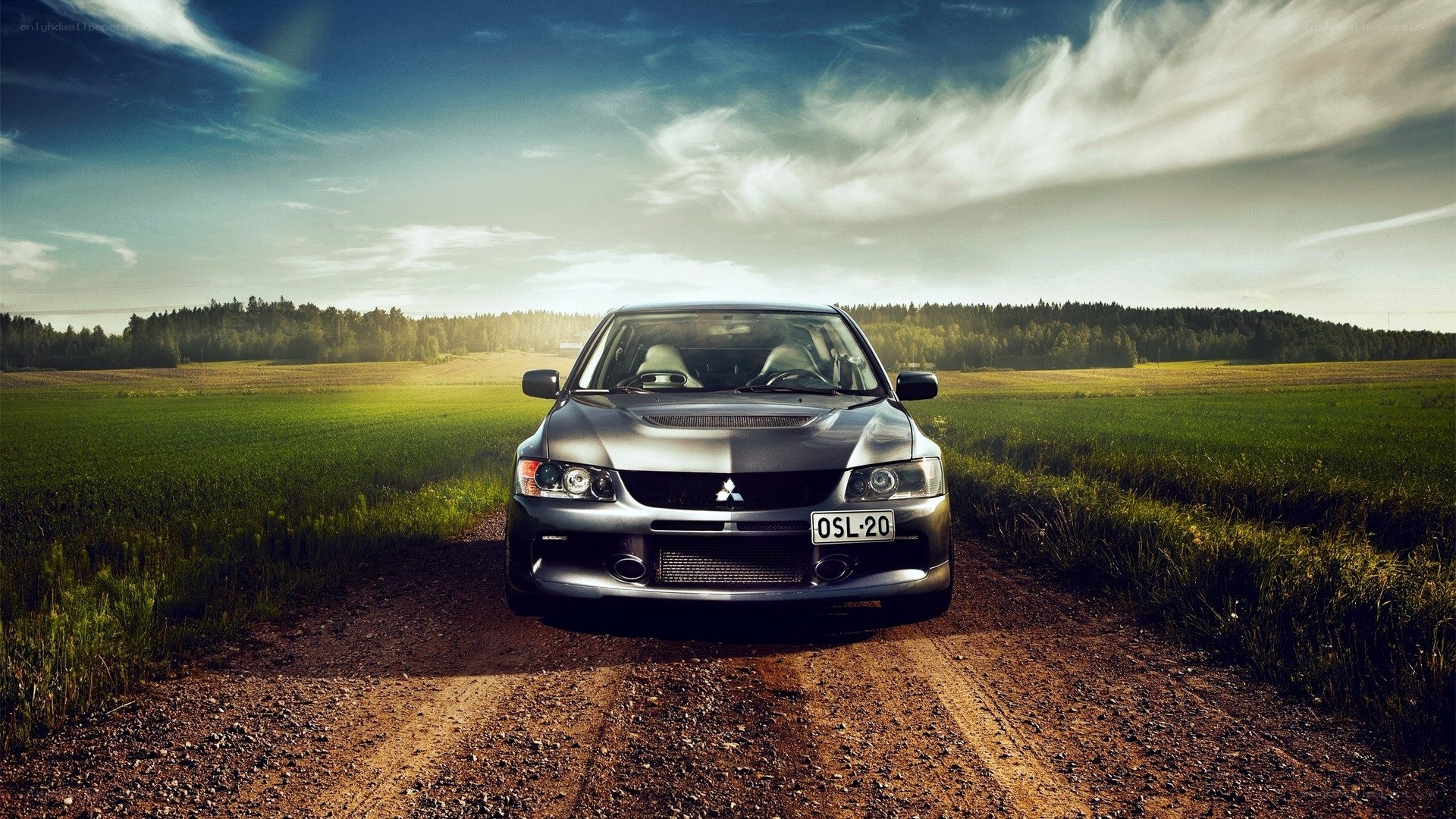 Silver car on a dirt road