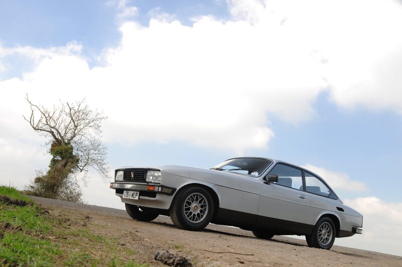Silver car on a hillside