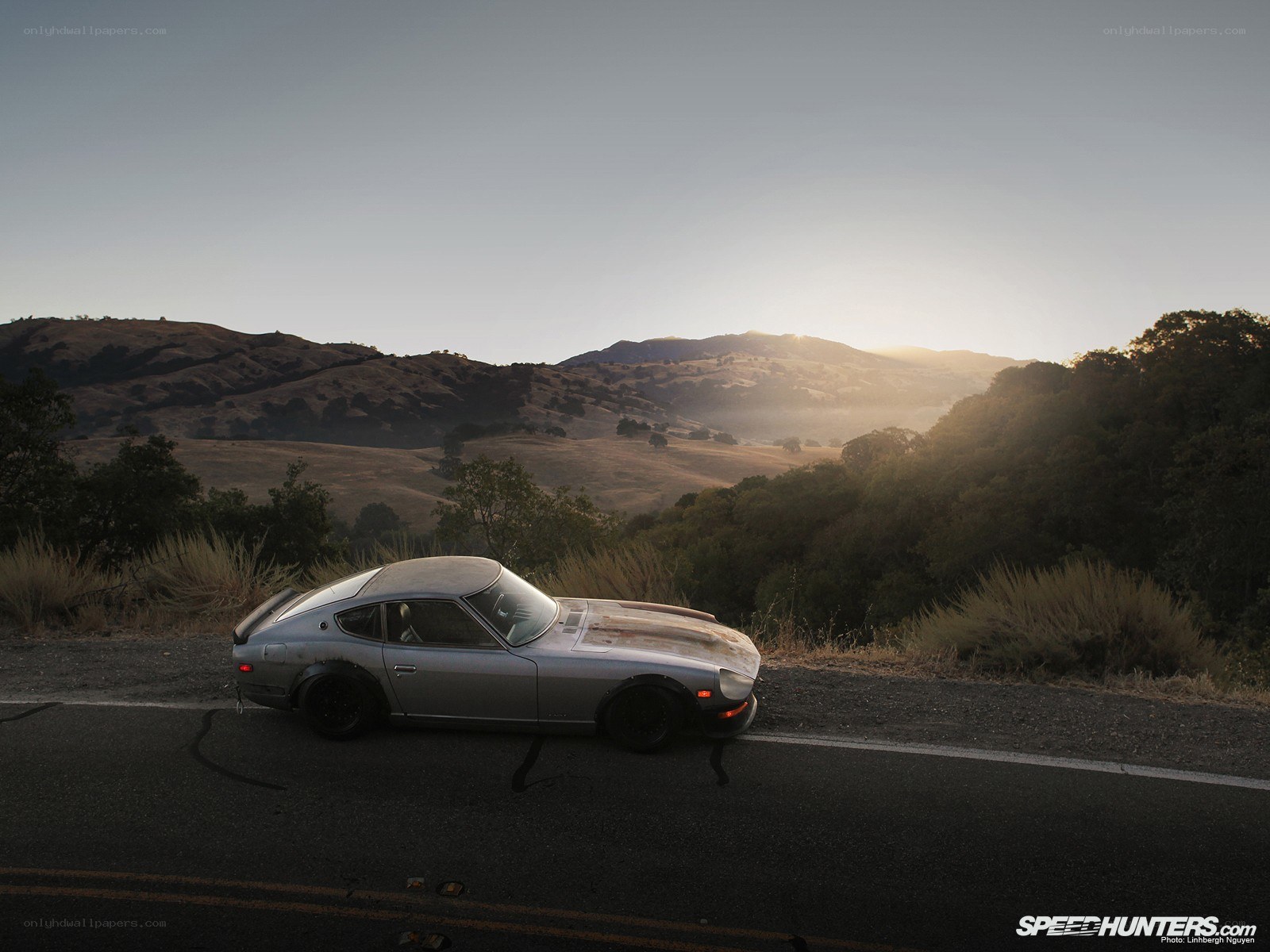 Silver car on a mountain road