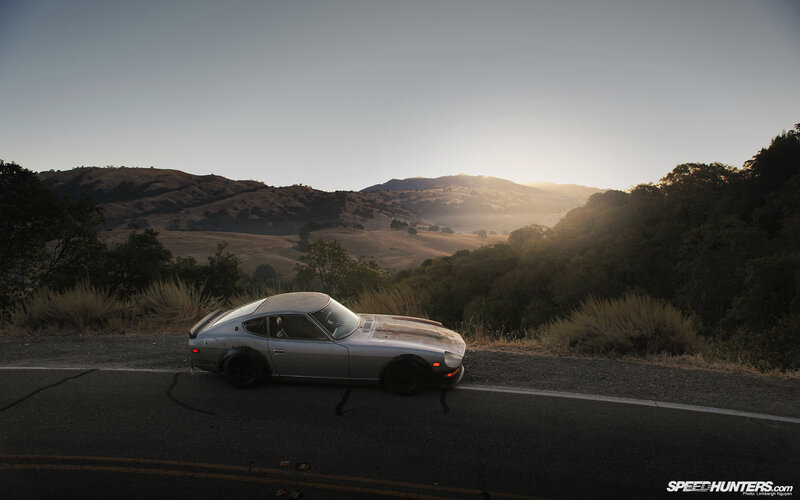 Silver car on a mountain road