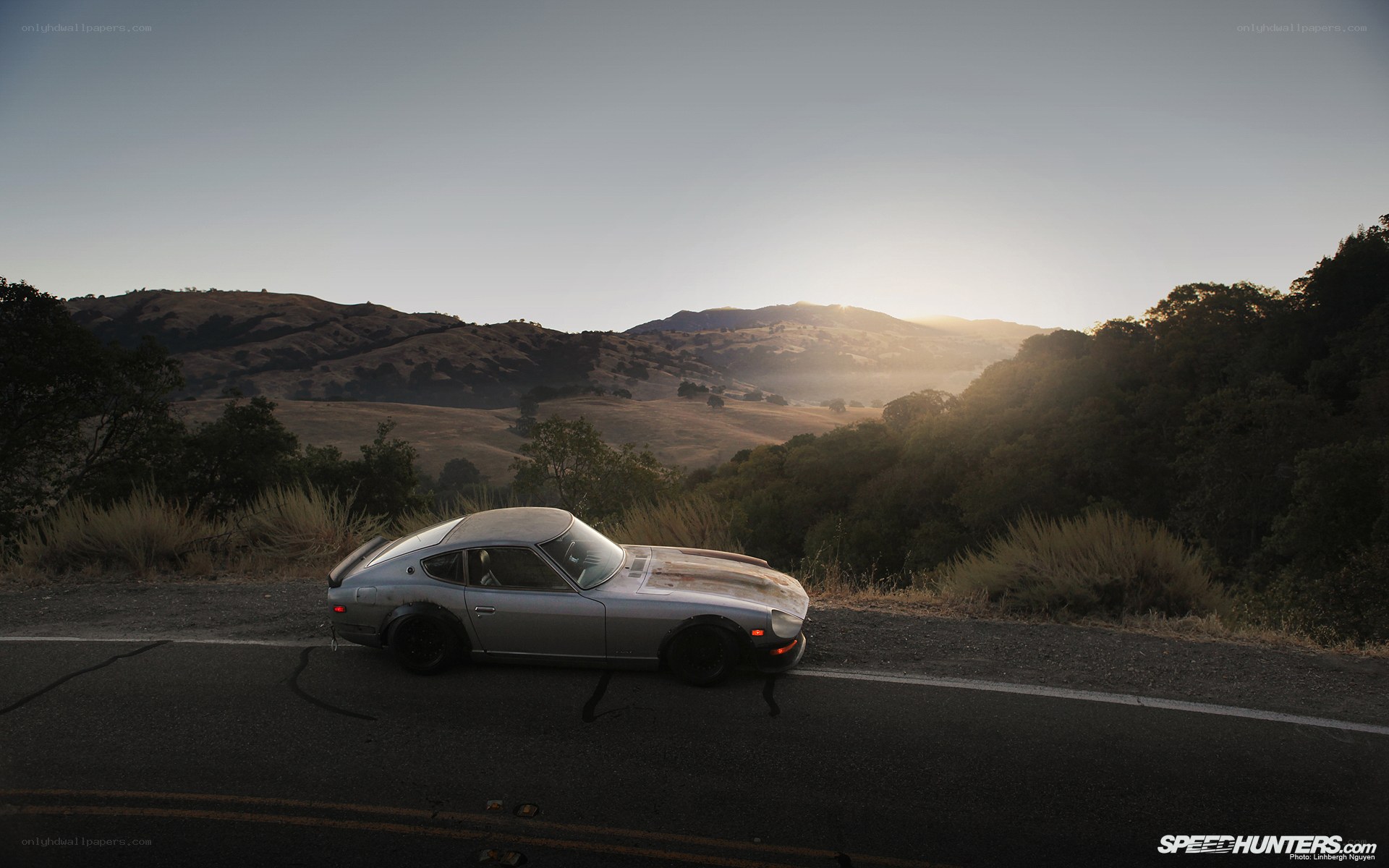 Silver car on a mountain road