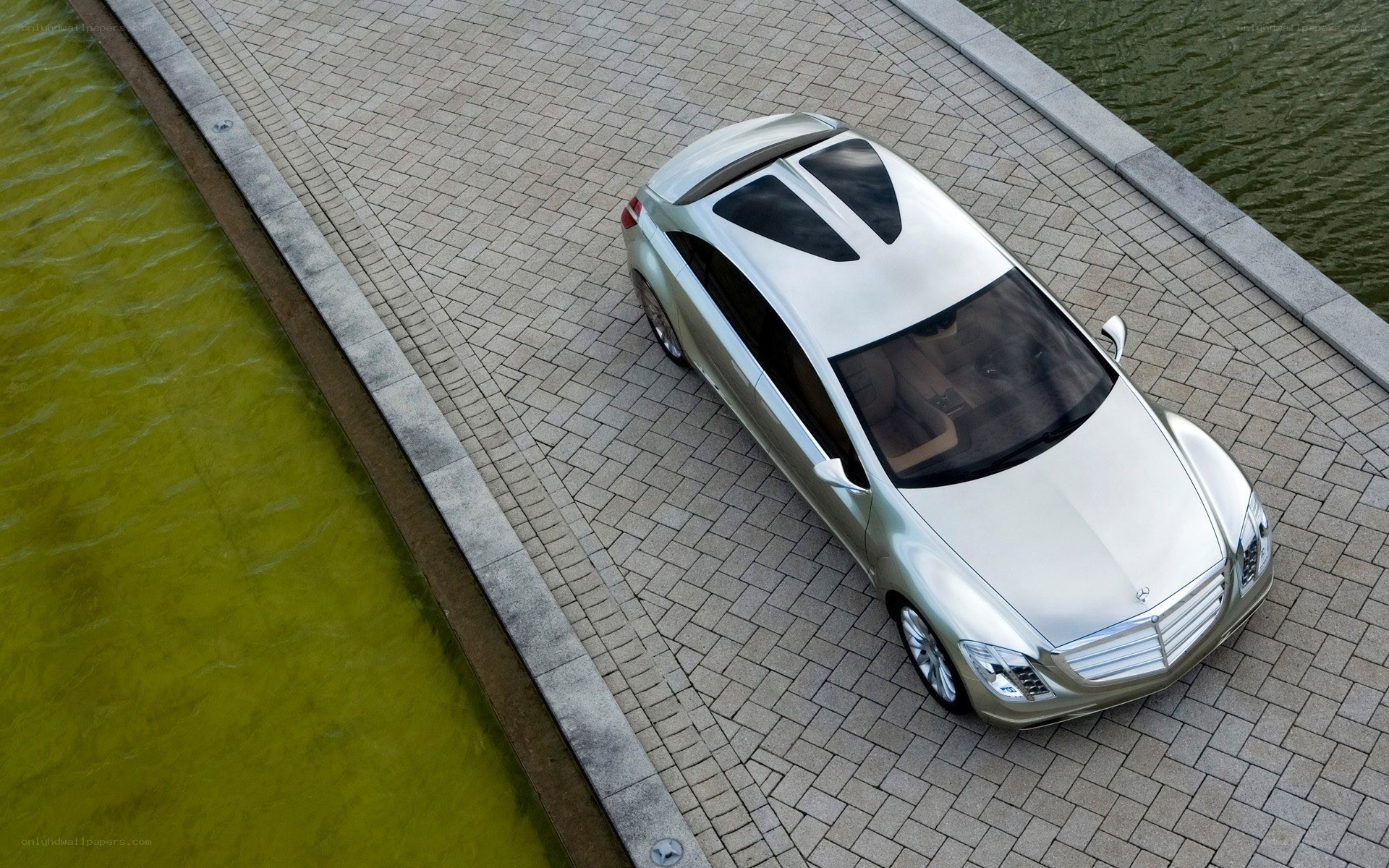 Silver car on a stone path