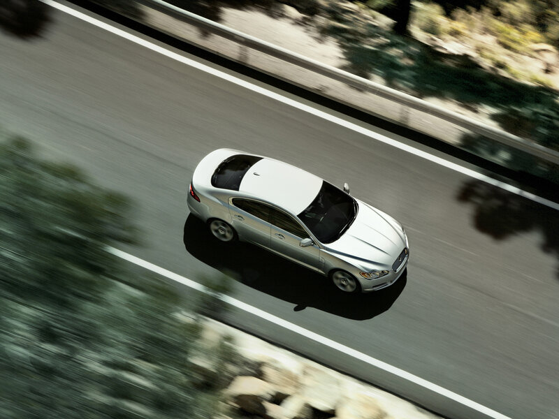 silver car on a winding road