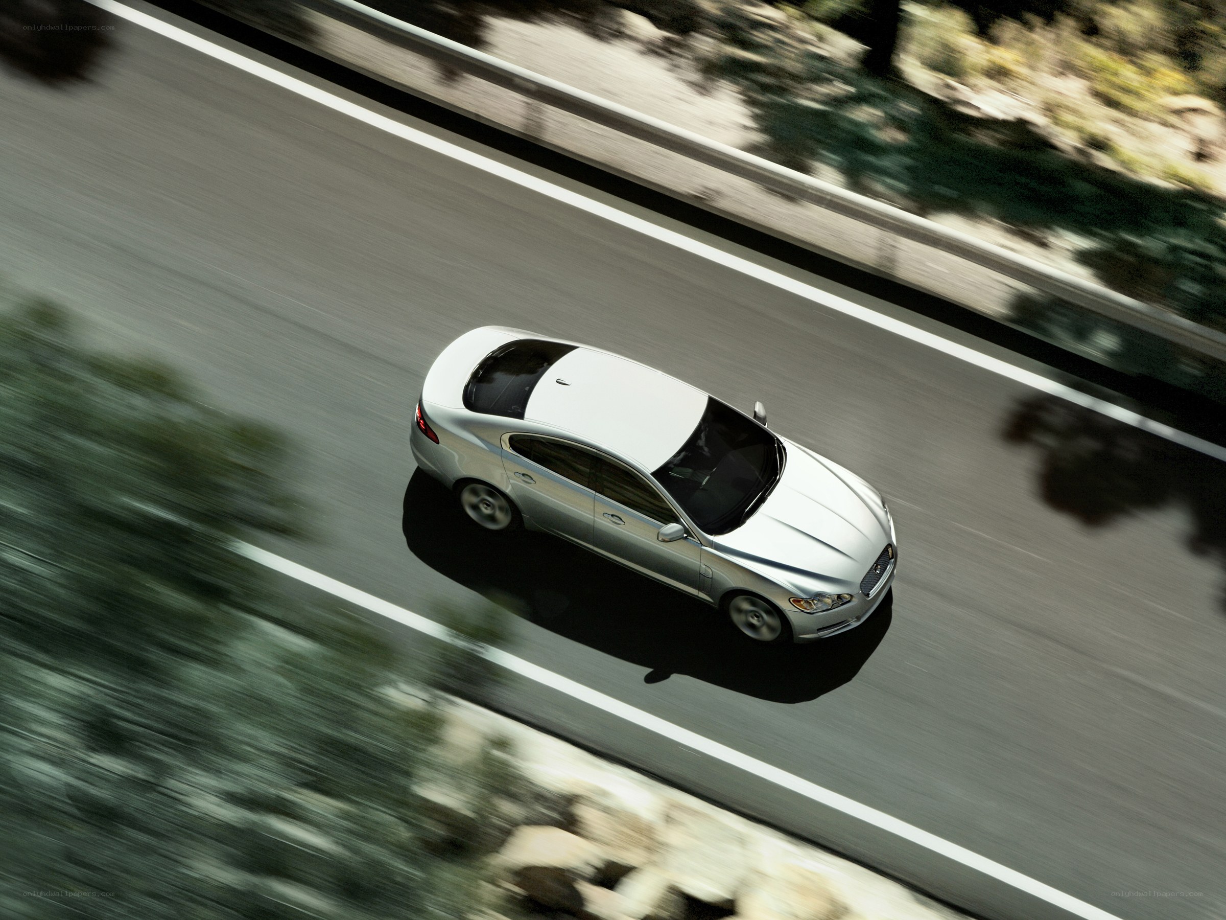 silver car on a winding road