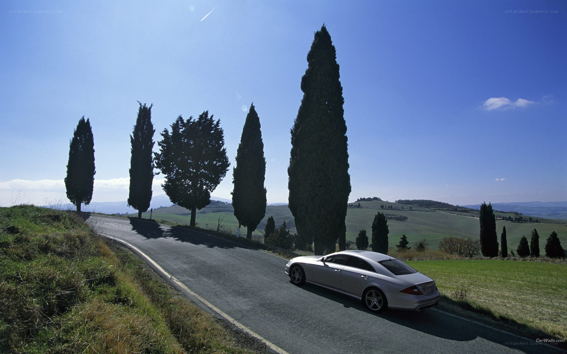 Silver car on a winding road