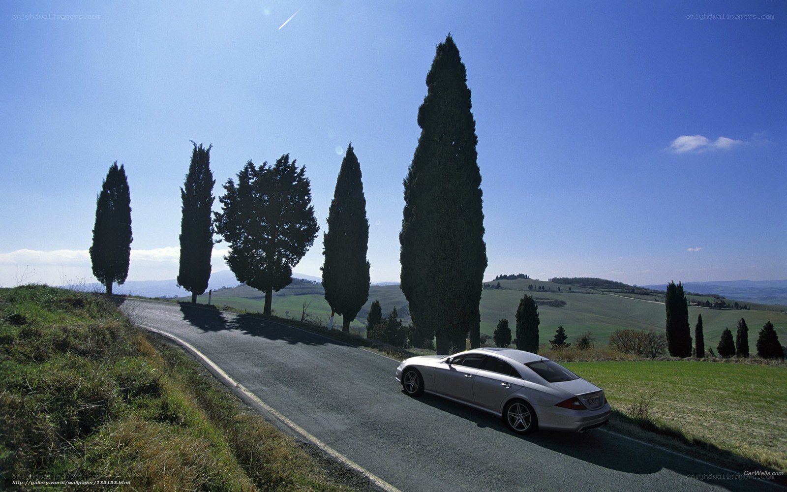 Silver car on a winding road