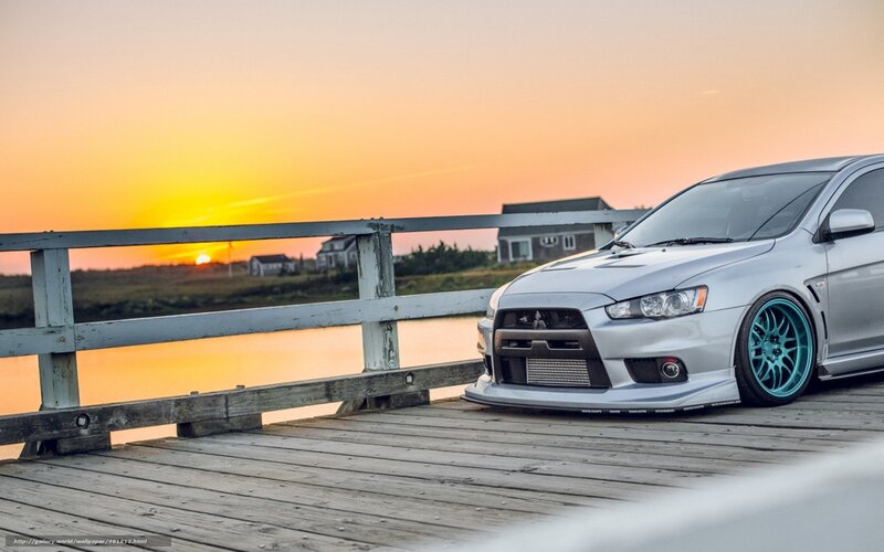 Silver car on a wooden bridge