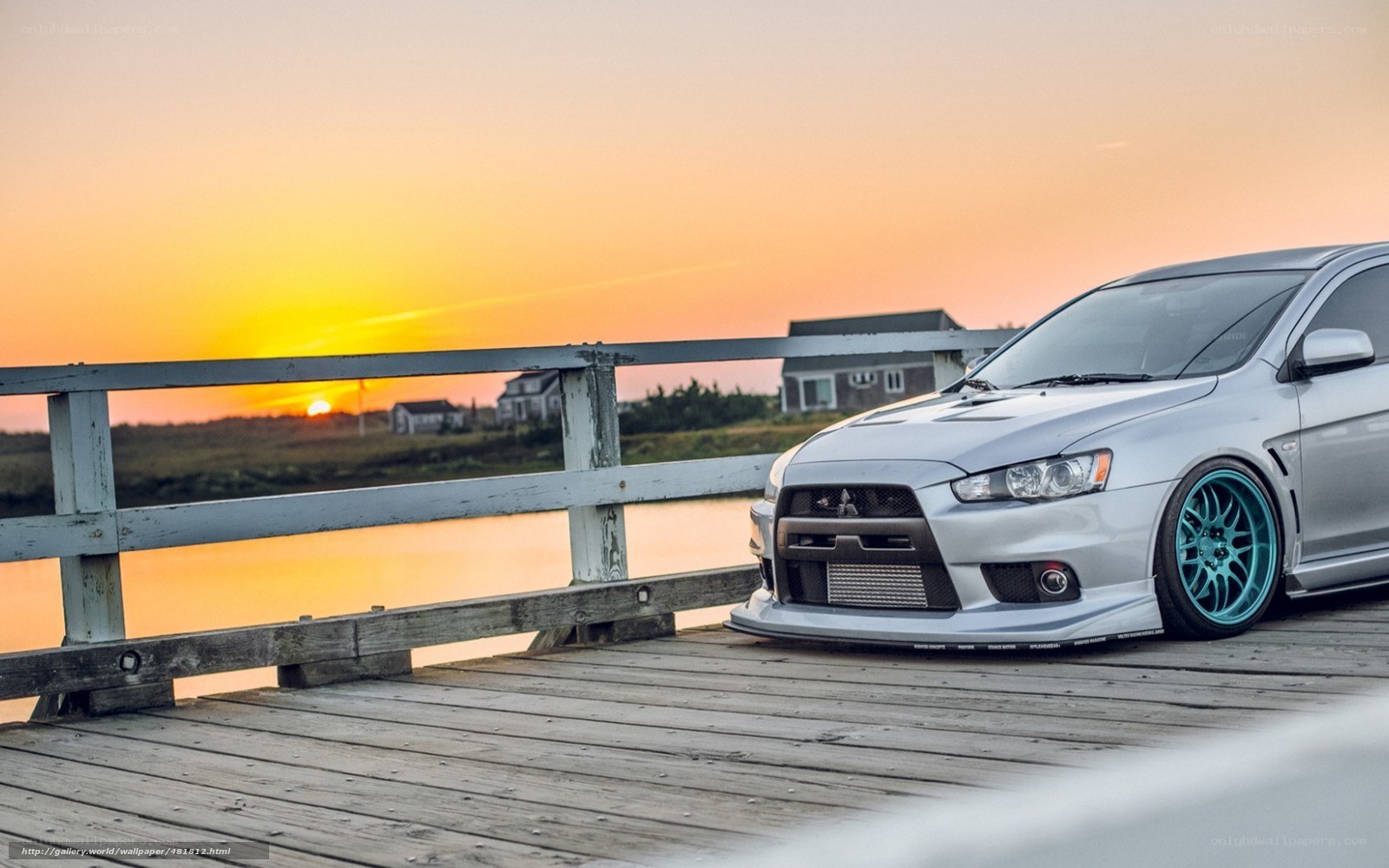 Silver car on a wooden bridge