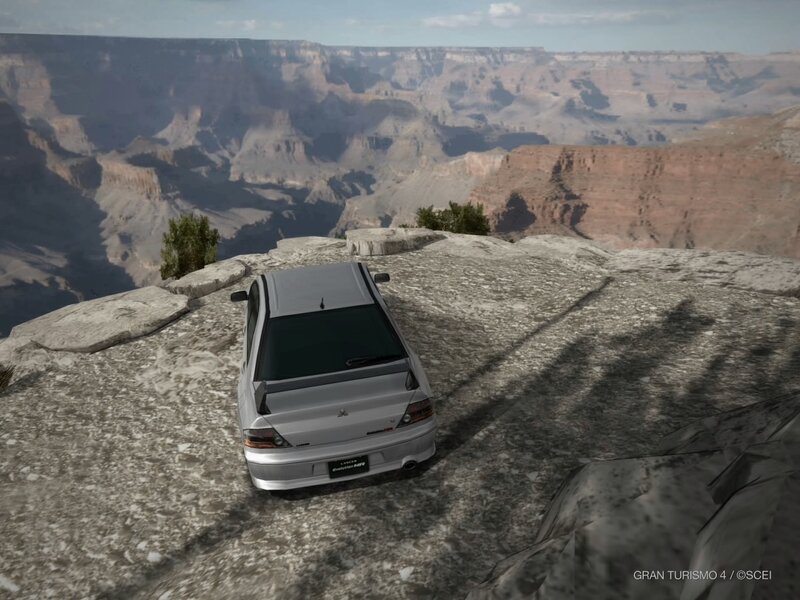 Silver car on canyon edge