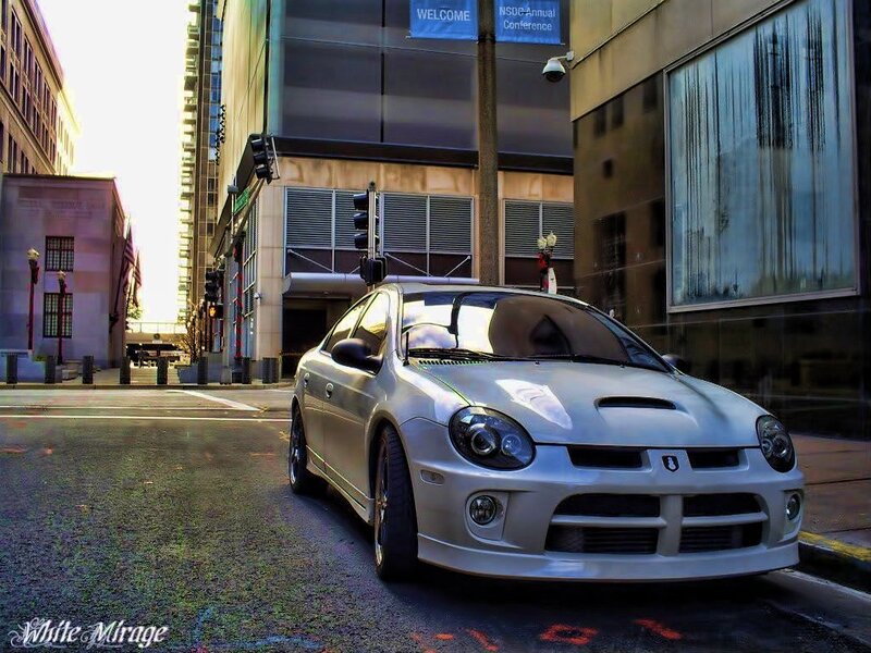 Silver car on city street