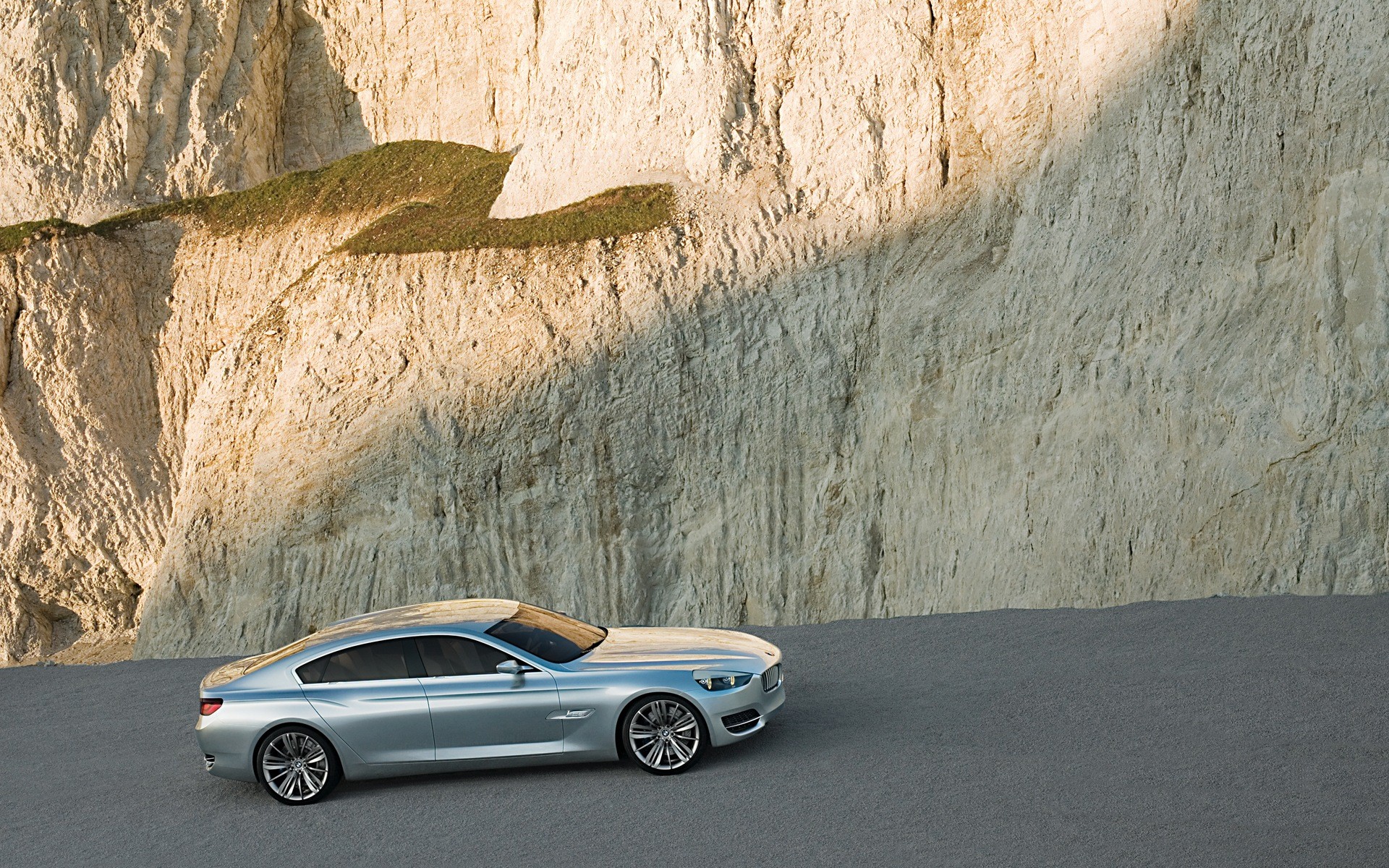Silver car on cliffside